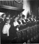 Kimpton Parish Church: The Church Choir singing in the Chancel, when the organ was located in the north transept, c1960