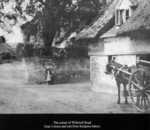 Kimpton High Street/corner Hitchin Lane, with old cottage on corner (now demolished) and Gray's horse & cart